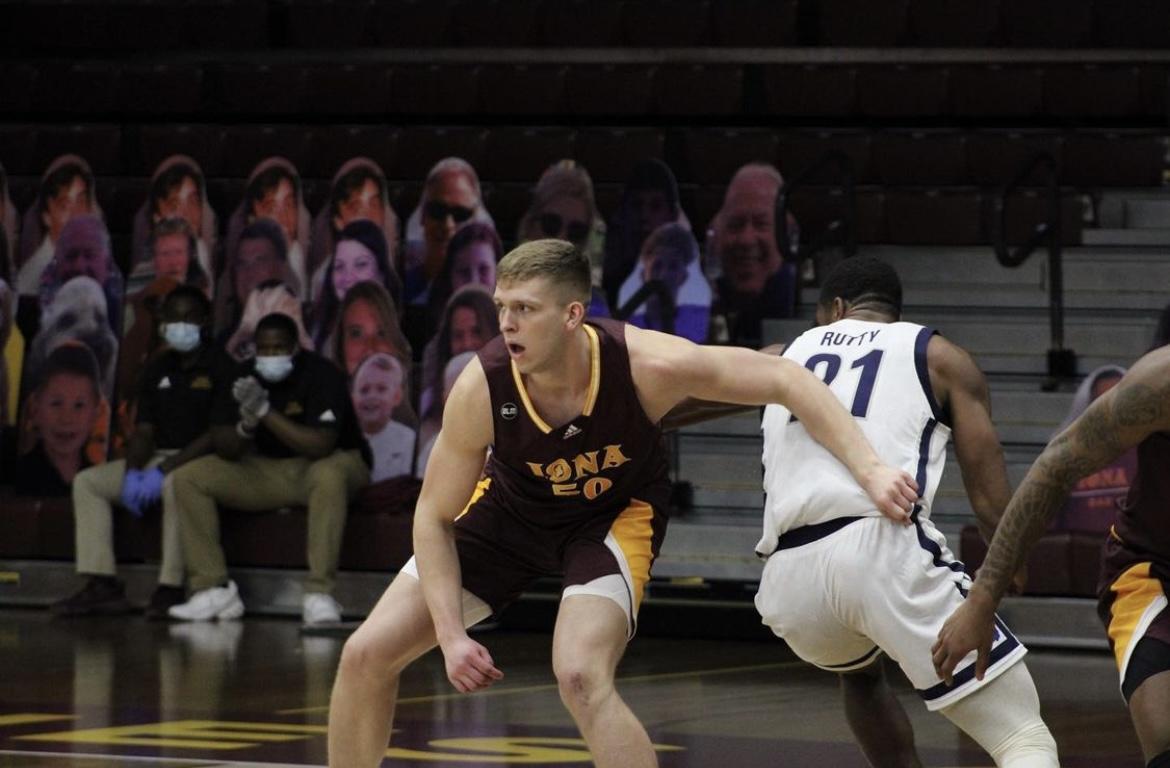 Trey James guards Nikkei Rutty of Monmouth. Photo credit: Cristina Suciu