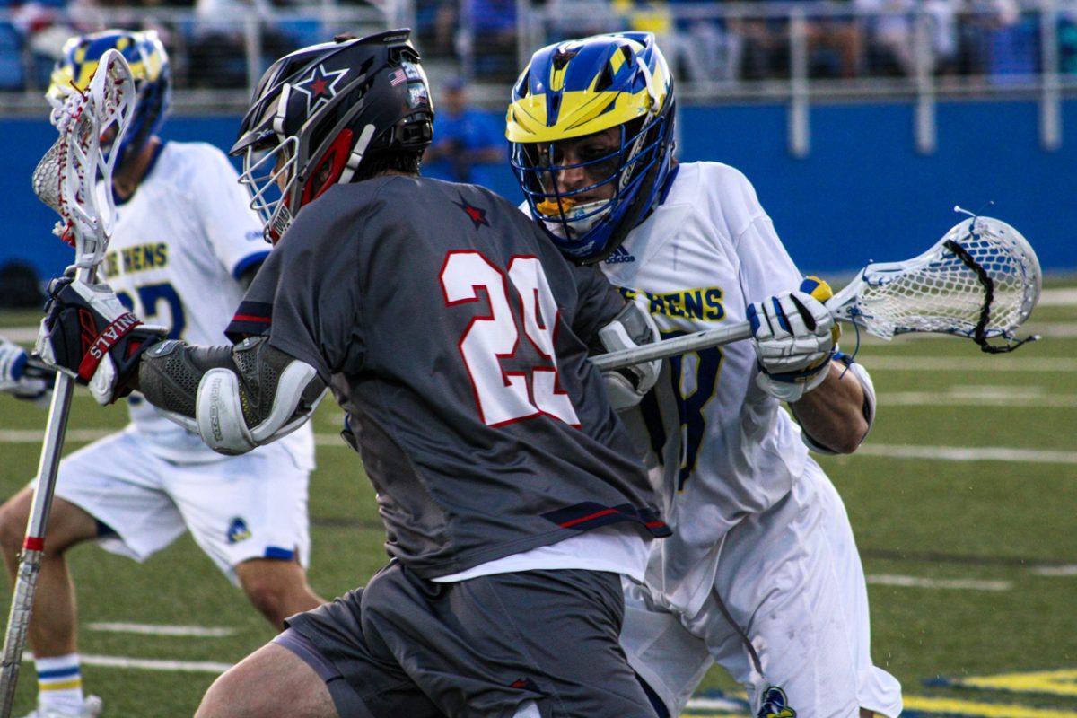 Dan Taddeo tries to run by Aidan Fritz of Delaware in Robert Morris’ 20-8 loss. Photo credit: Tyler Gallo