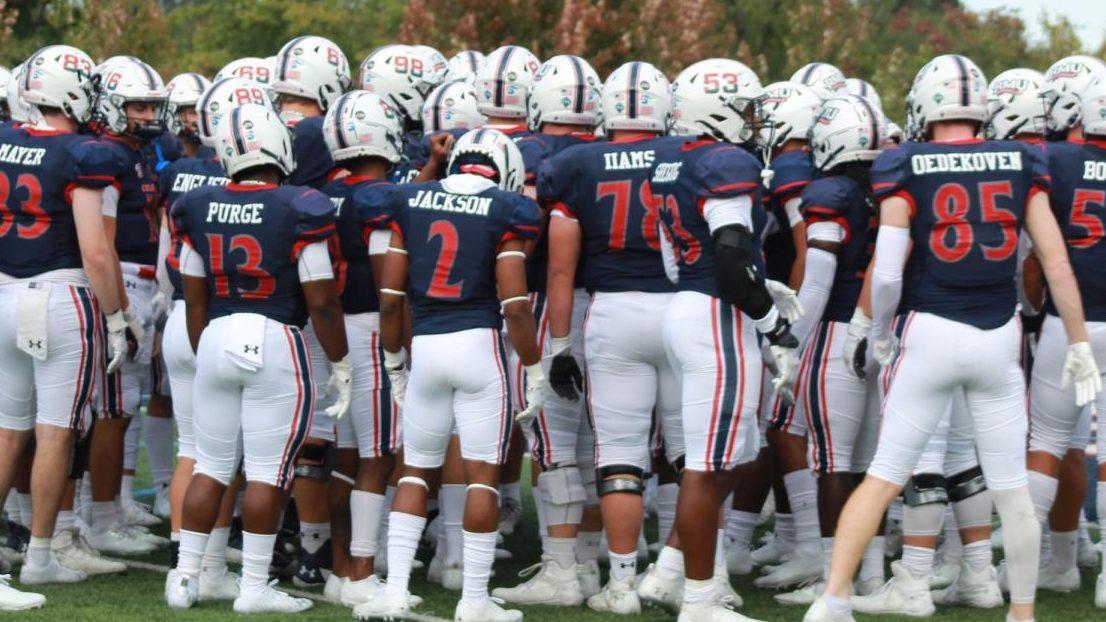 The team huddles up before their game against Howard on September 25, 2021 Photo credit: Ethan Morrison