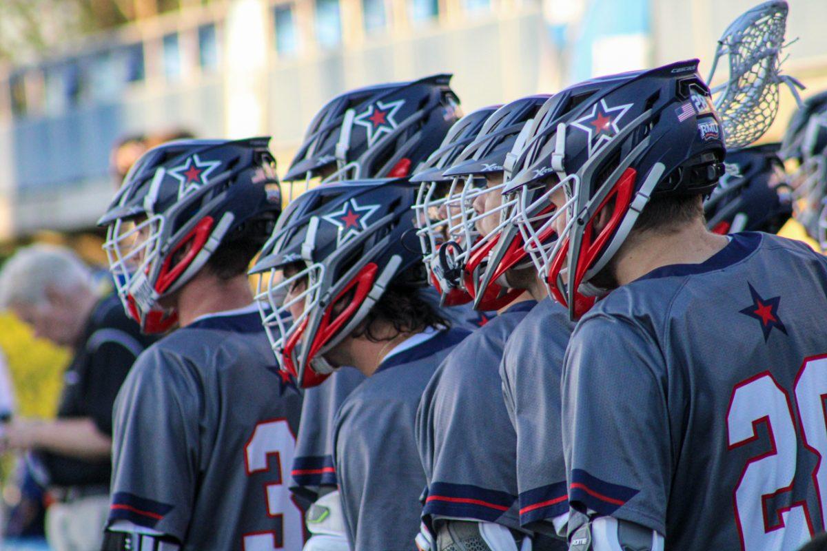 Players look on from the sidelines during their game against Delaware in the NCAA Tournament on May 11, 2022 Photo credit: Tyler Gallo