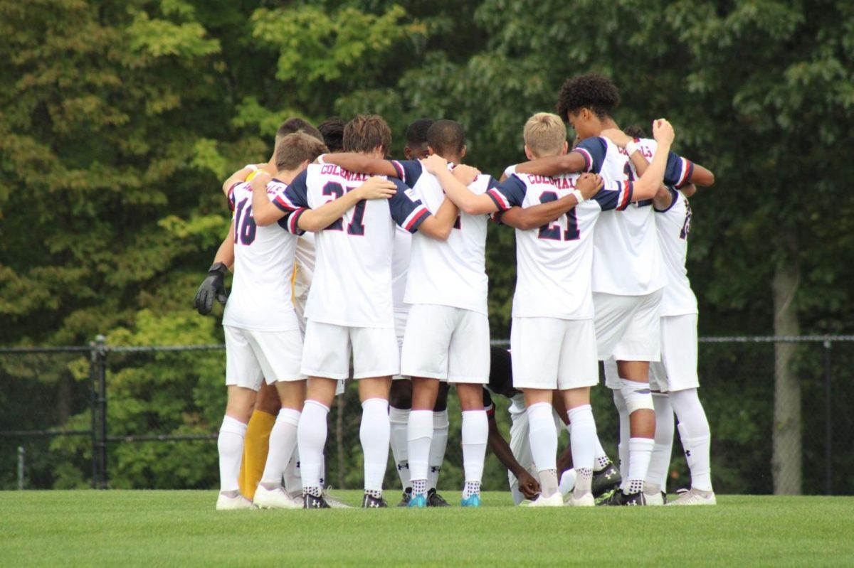 The+team+huddles+before+their+game+against+Xavier+on+September+15%2C+2021+Photo+credit%3A+Nathan+Breisinger