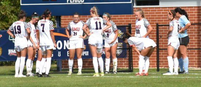 The team huddles during the second half against Northern Kentucky on October 2, 2021 