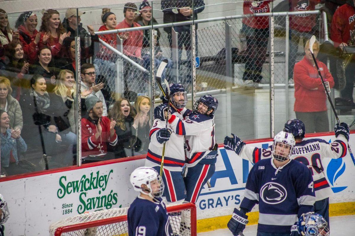 Mens+hockey+celebrates+a+goal+against+Penn+State.+Photo+credit%3A+David+Auth