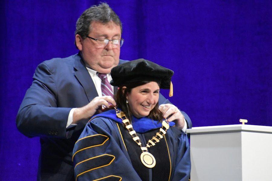 Chair of the board of trustees Morgan OBrien  performs the Investiture of the President during President Michelle Patricks Inauguration ceremony on Oct. 7, 2022  