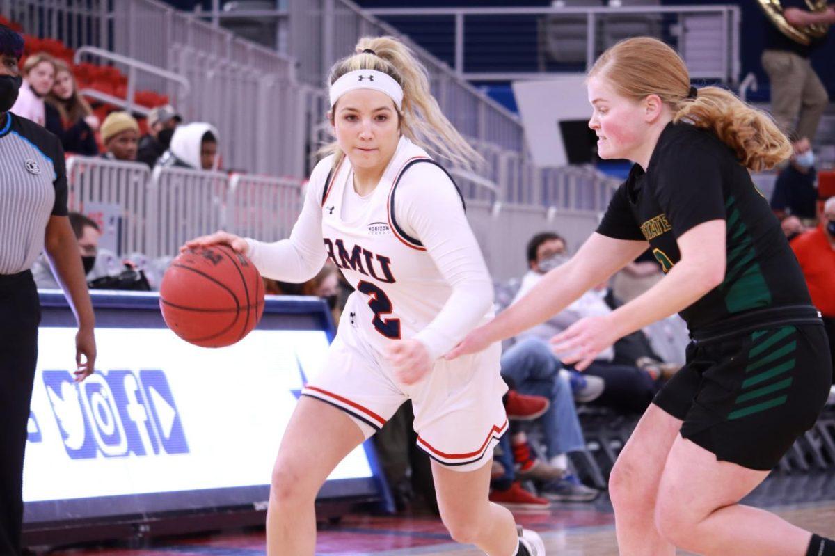 Mackenzie Amalia drives down the court in a game against Wright State on February 18, 2022 Photo credit: Tyler Gallo