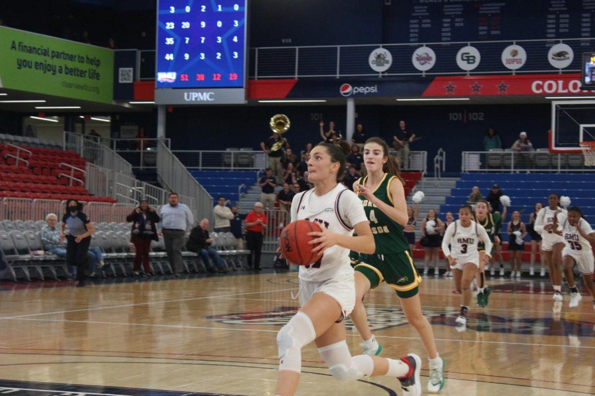 Alejandra Mastral drives in for the game-winning layup in the 53-52 win over George Mason Photo credit: Michael Deemer