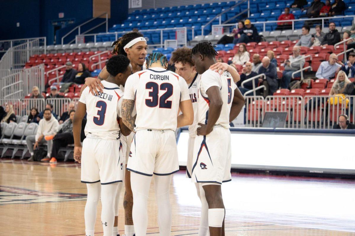 The team huddles during the 77-70 win over IUPUI Photo credit: Julia Wasielewski