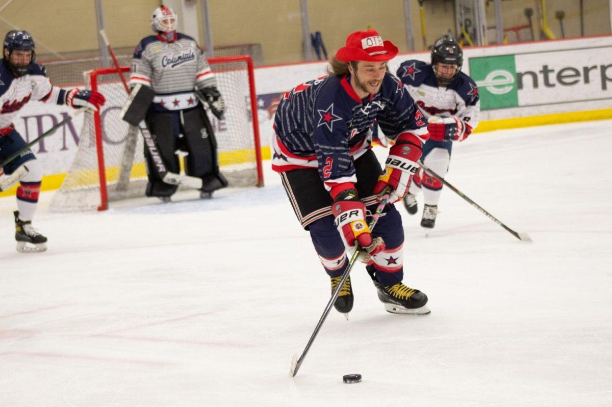 Jacob from On the Bench stick handles during the Second Annual Celebrity Hockey Game Photo credit: Julia Wasielewski