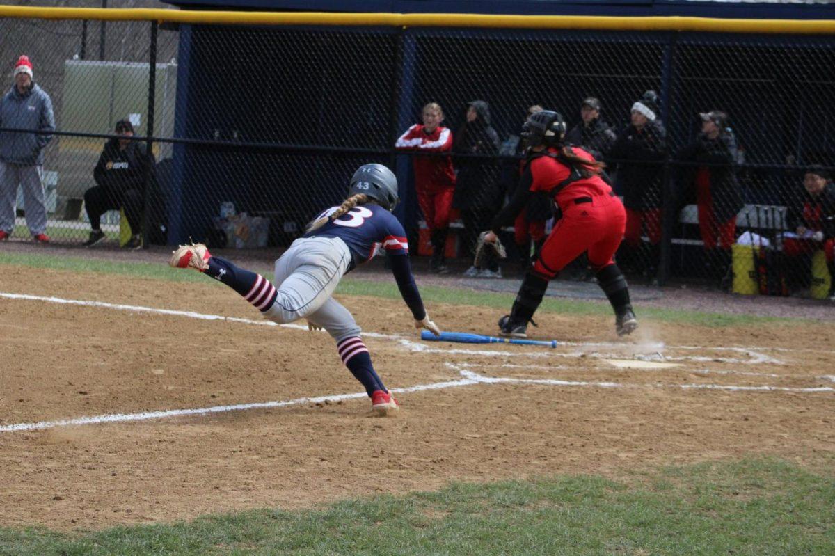 Alaina Koutsogiani dives into home plate against IUPUI on April 17, 2022 Photo credit: Cameron Macariola