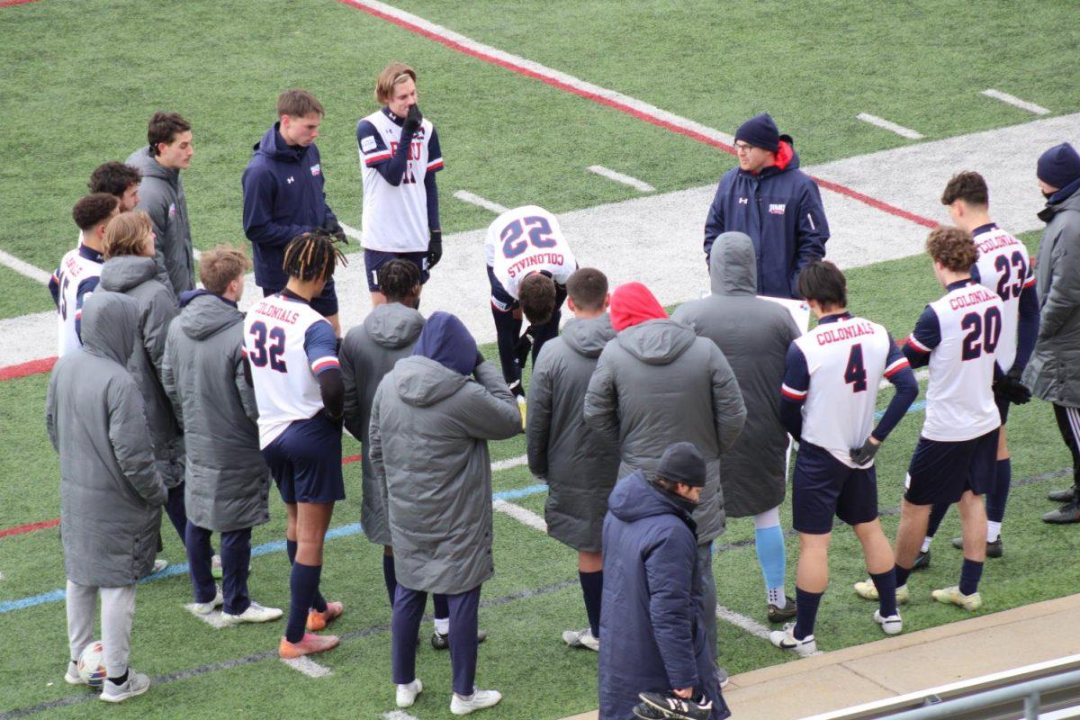 The team huddles during their spring game against Wheeling on Mar. 19 Photo credit: Samantha Dutch