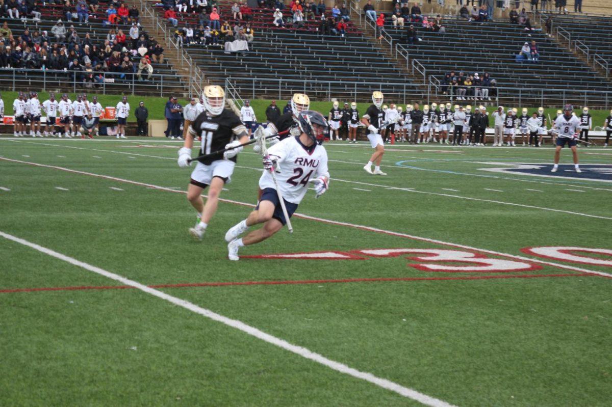 Steven DelleMonache cradles the ball in the 18-12 win over Lindenwood Saturday Photo credit: Finn Lyons