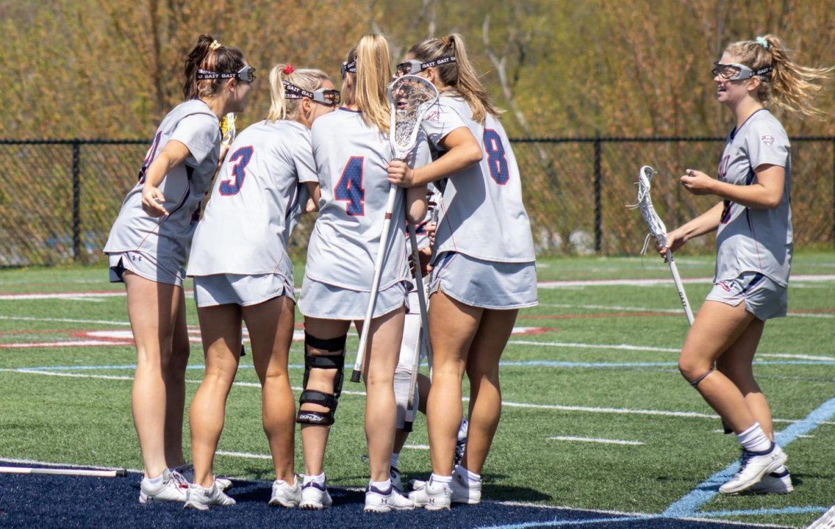 The team celebrates a goal in the 19-7 win over the Eastern Michigan Eagles