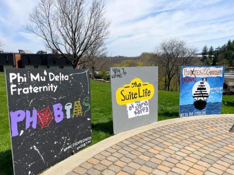 Sororities and fraternities painted signs of their upcoming Airband themes showcased at the firepit this afternoon. Photo credit: Samantha Dutch