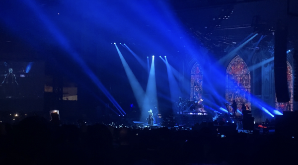 Papa Emeritus IV sings He Is while the audience lights their phones.