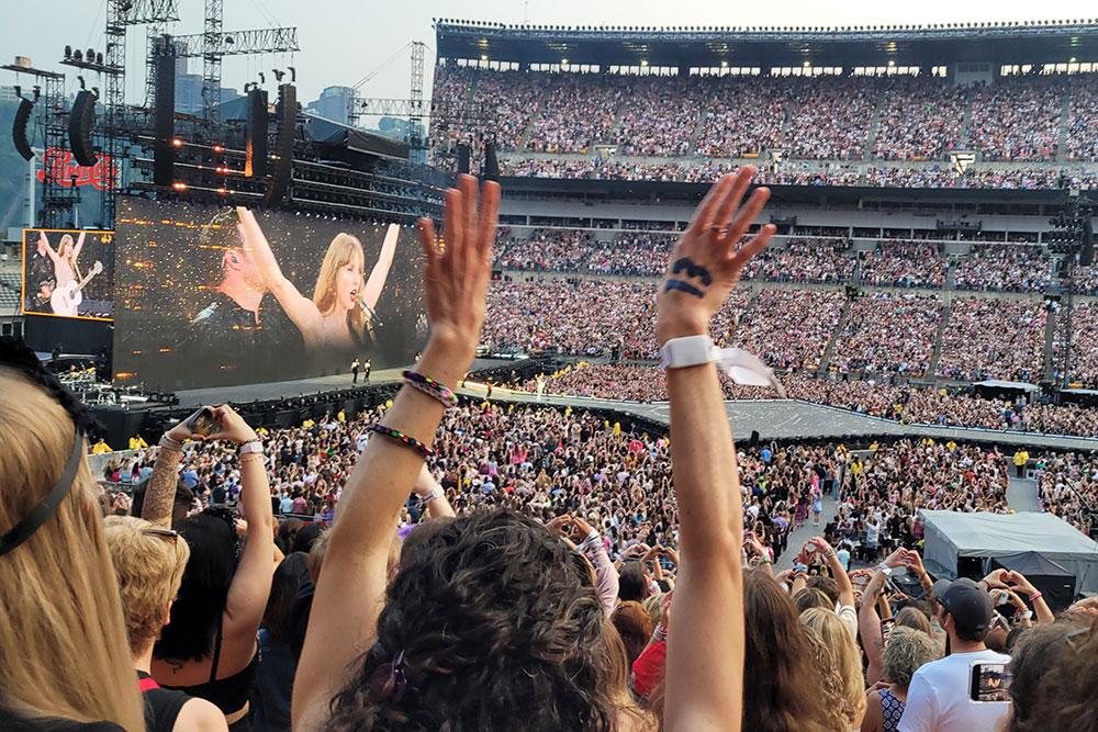 Fans at Acrisure Stadium watching the Taylor Swift concert
