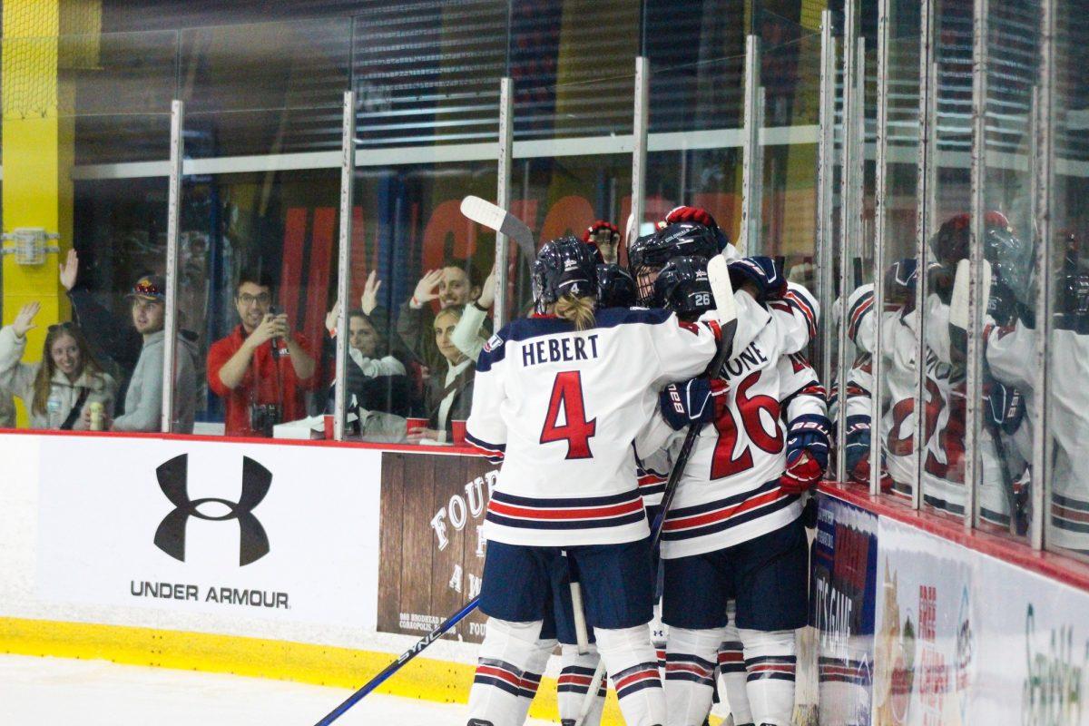 The team celebrates after a goal in a dominating 6-1 win over Saint Anselm