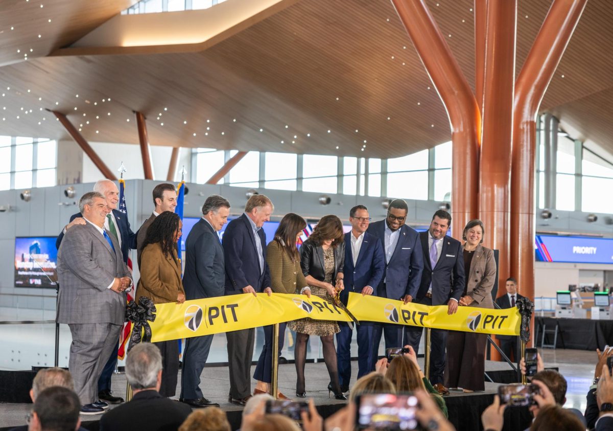 ACAA CEO Christina Cassotis marks a milestone moment as she cuts the ribbon to celebrate the completion of the new terminal. Photo credit: Jadyn Barker