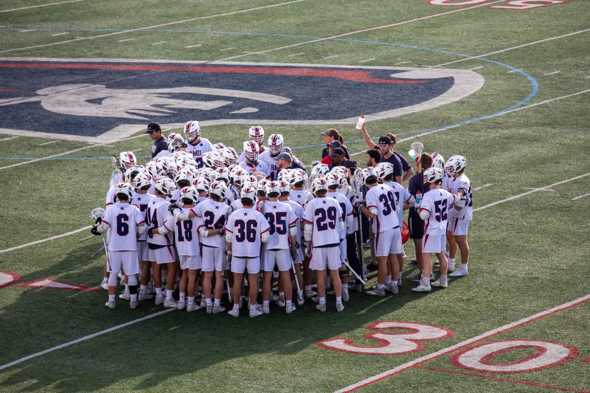 The RMU Men's Lacrosse Team Huddles Up in Their NCAA Tournament Game Last Spring Photo credit: Jadyn Barker